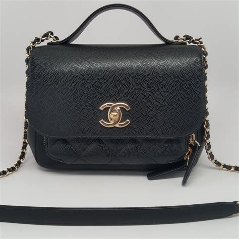 chanel mini|Chanel mini flap bag with top handle.